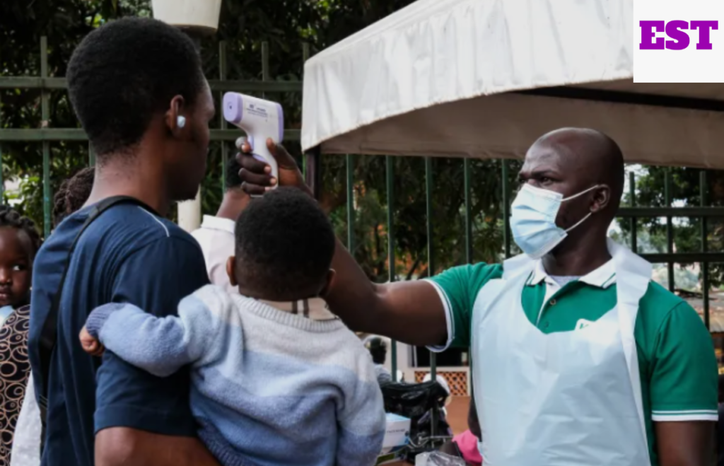 Picture of a person being scanned by medical expert for Ebola disease amidst the Ebola outbreak in Congo and Uganda