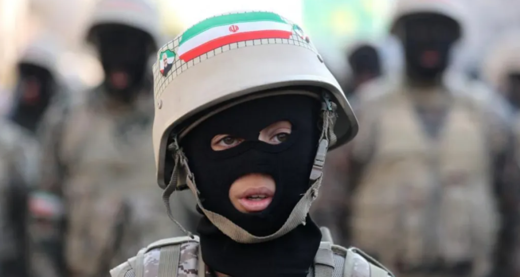 A teenager fully armed in the military